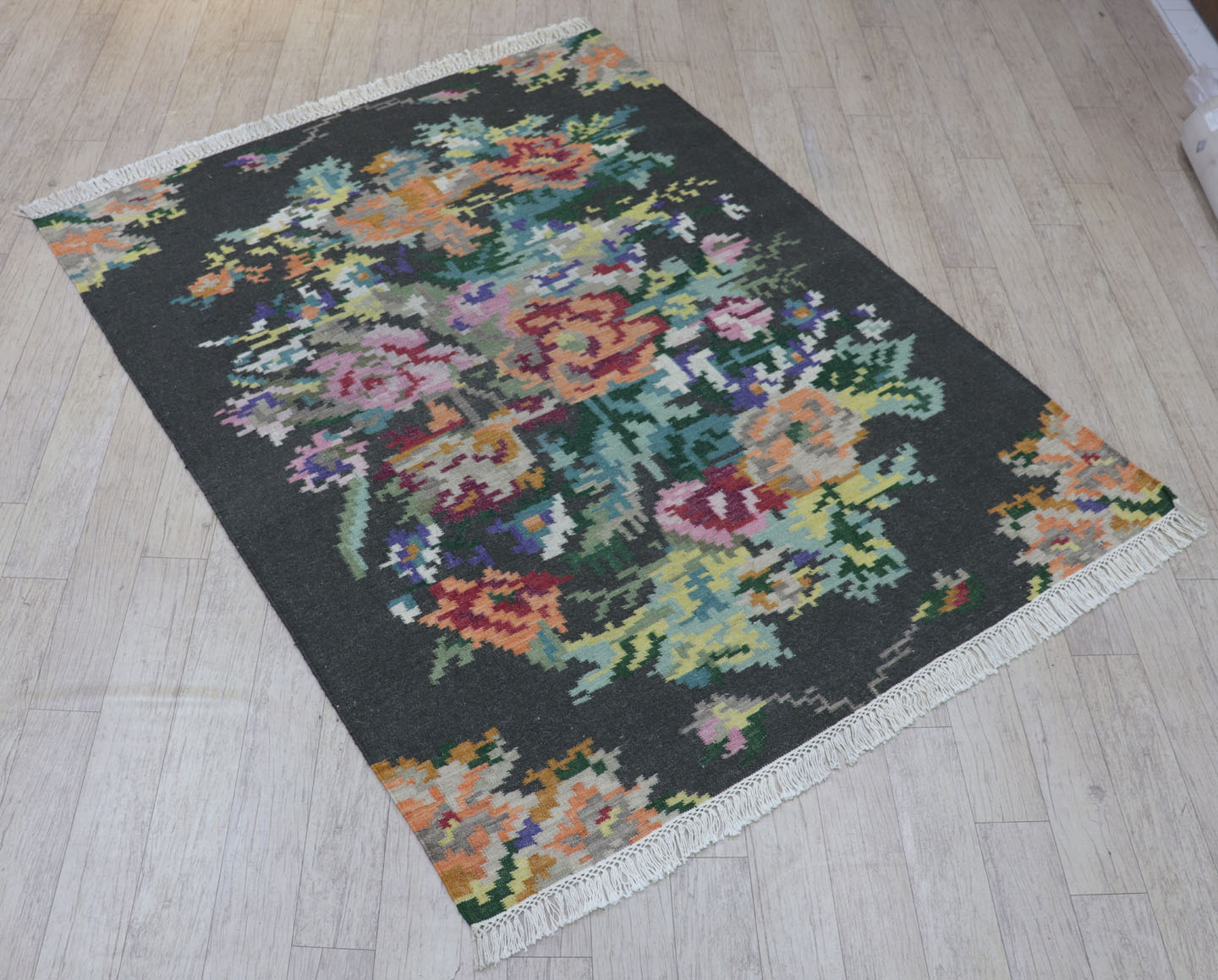 Hand woven rug with fringes